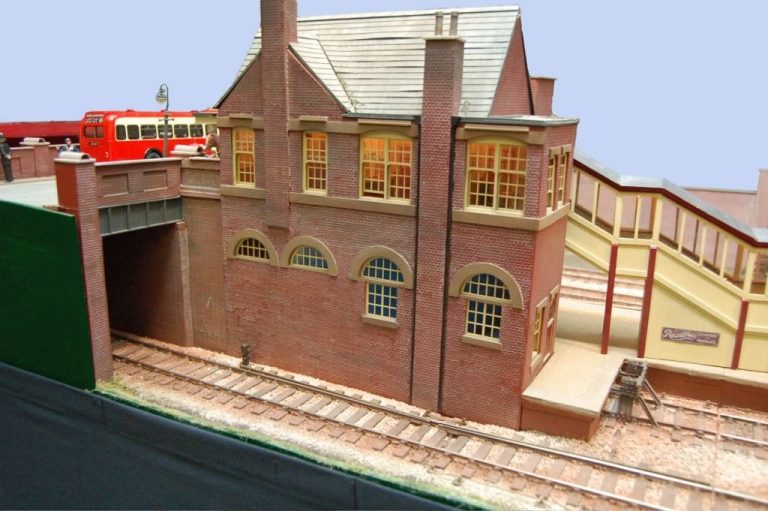 Brick station building and footbridge at Abbotstone