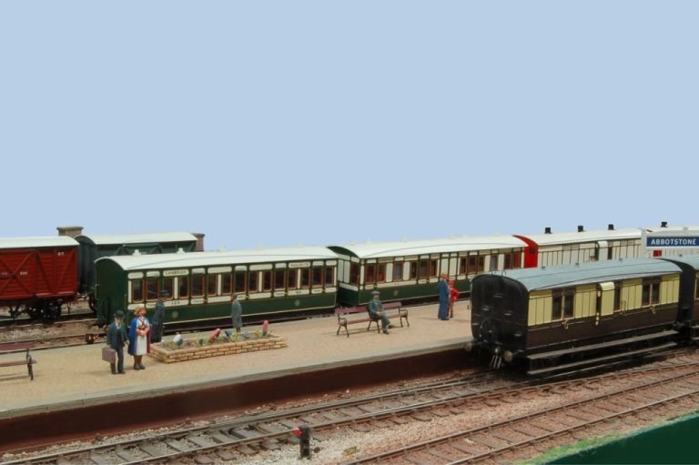 Coaches standing at the platform with passengers waiting at Abbotstone