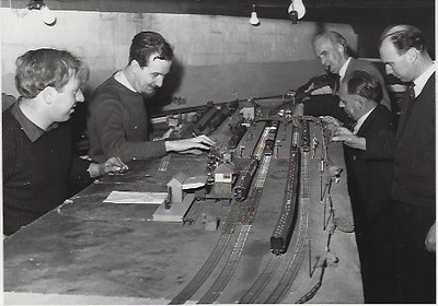 Club members working on a layout in the club room