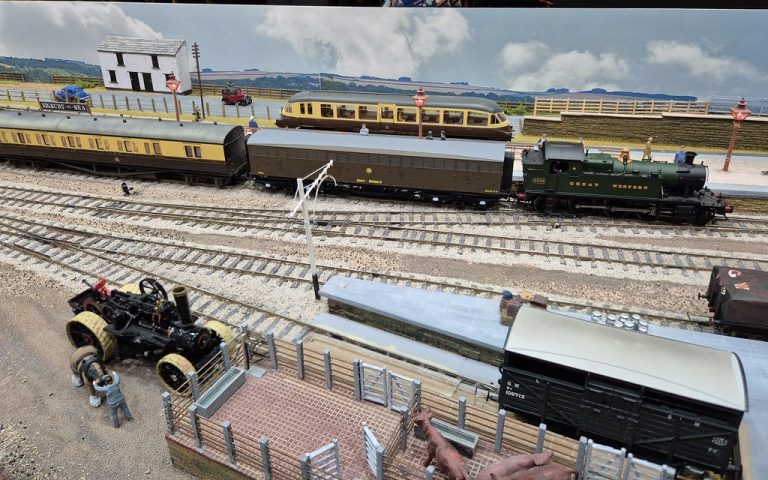 GWR chocolate and cream coaches and a traction engine at Bigbury-on-Sea