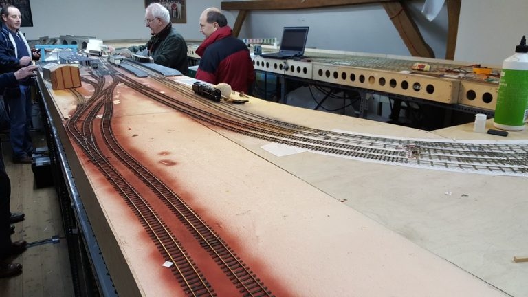 Members building the Redbridge Wharf baseboards in the club room