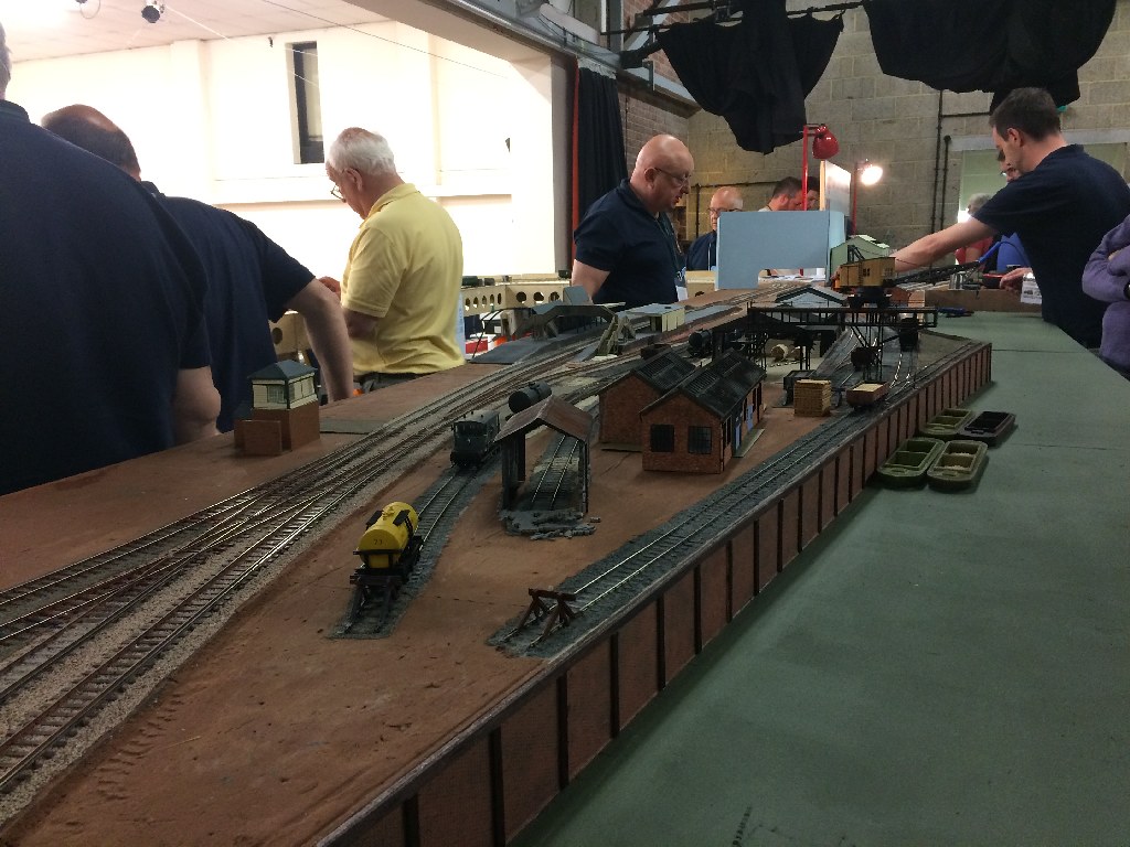 Members gathered round a layout on a club night