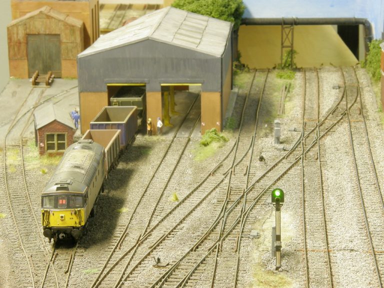 Locomotive leaving the engine shed at Cramdin Yard