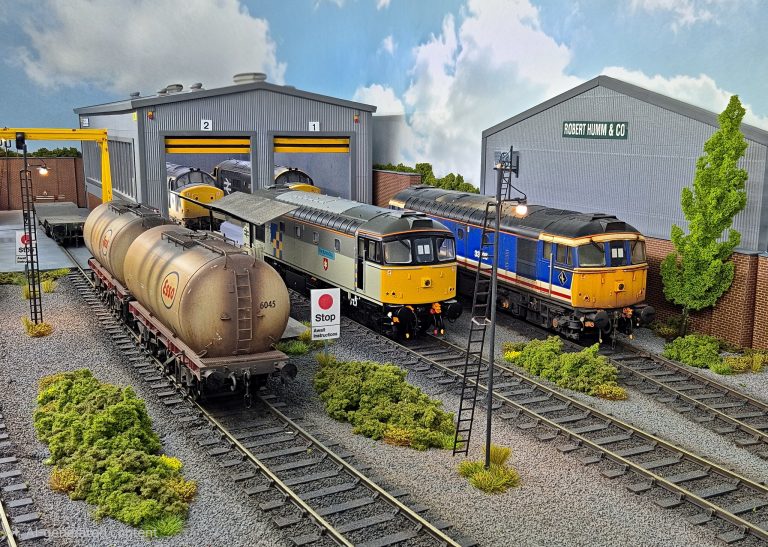Class 33s and oil tanks outside the depot shed at Lockton Lane