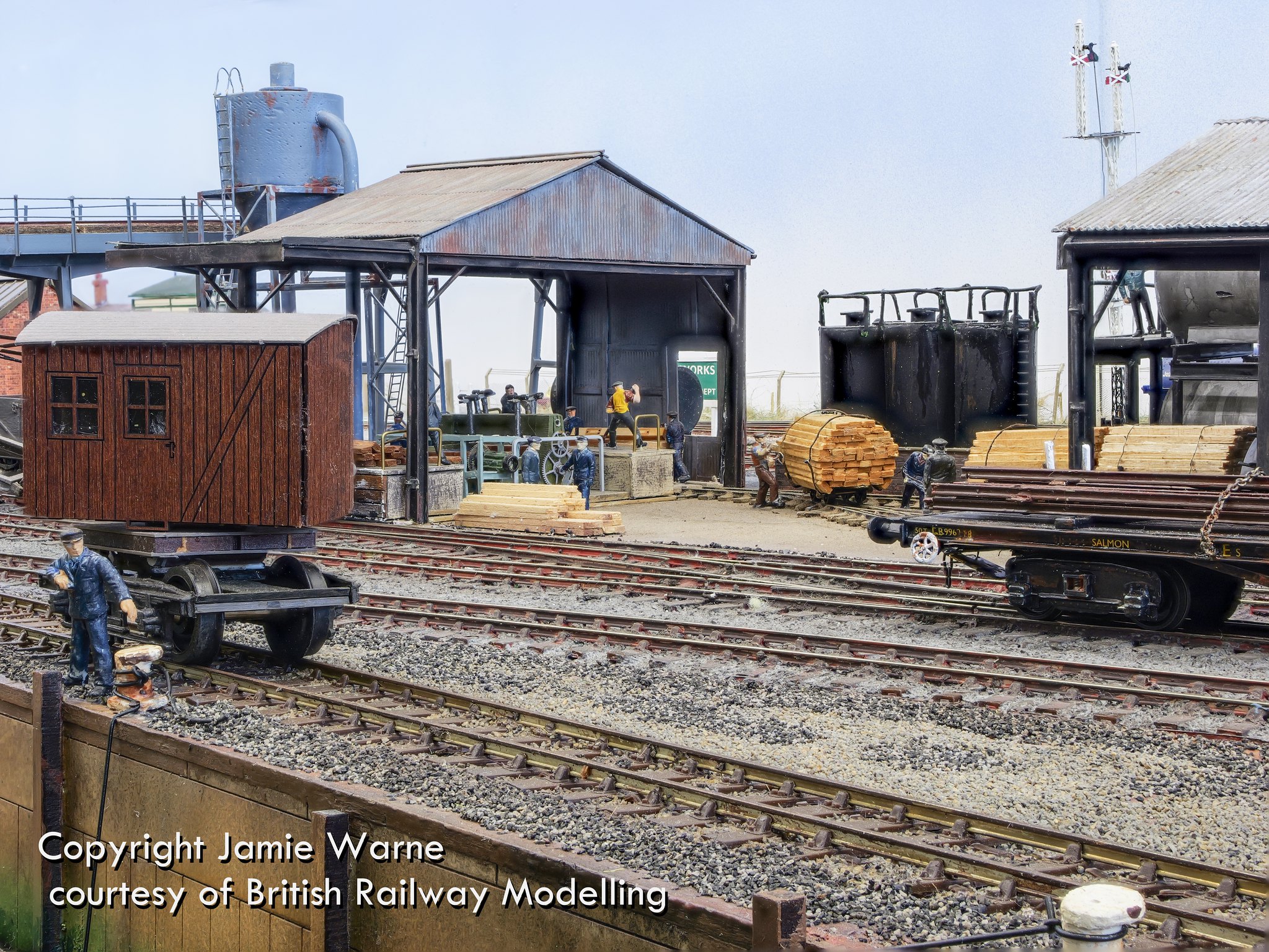Creosoting plant at the Redbridge sleeper works with wagons and a brake van in the yard