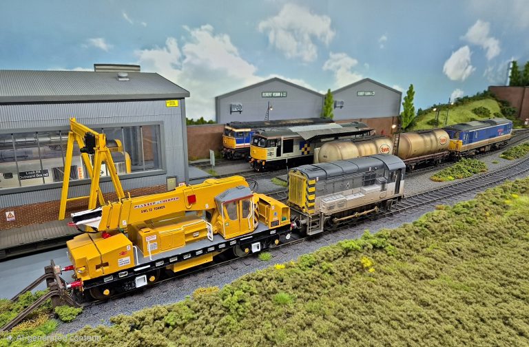 Yellow engineers' crane and Network SouthEast locomotives at the Lockton Lane depot
