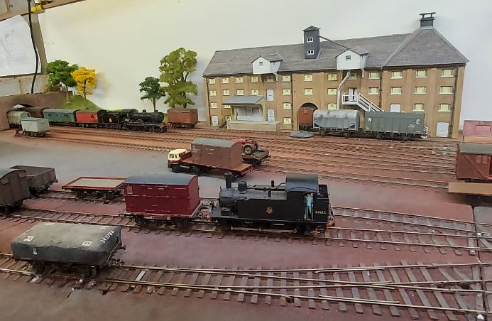 Tank engines and wagons in front of the maltings at St Holdens